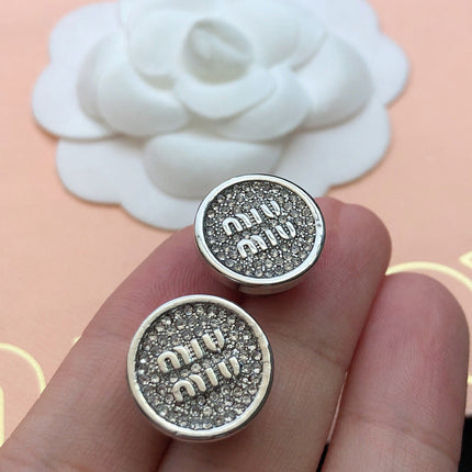MIUMIU 26S CRYSTAL MIU LOGO ROUND STUD EARRINGS IN SILVER TONE METAL 630845
