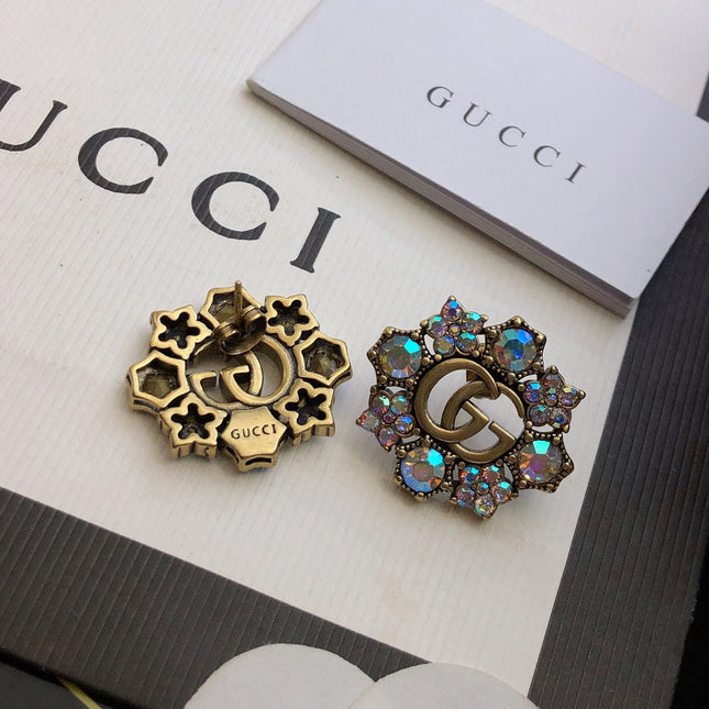 GUCCI 26S DOUBLE G LOGO MULTICOLOR CRYSTAL FLORAL STATEMENT STUD EARRINGS IN AGED GOLD TONE METAL 629028