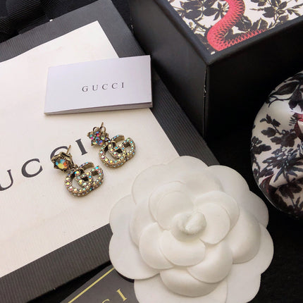 GUCCI 26S DOUBLE G LOGO MULTICOLOR CRYSTAL DROP STATEMENT EARRINGS IN AGED GOLD TONE METAL 629027