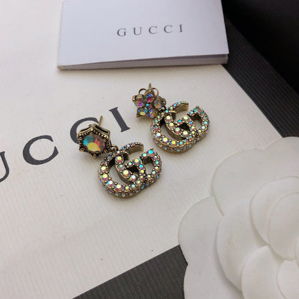 GUCCI 26S DOUBLE G LOGO MULTICOLOR CRYSTAL DROP STATEMENT EARRINGS IN AGED GOLD TONE METAL 629027