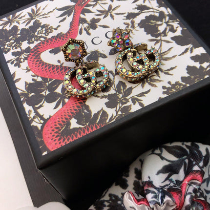 GUCCI 26S DOUBLE G LOGO MULTICOLOR CRYSTAL DROP STATEMENT EARRINGS IN AGED GOLD TONE METAL 629027