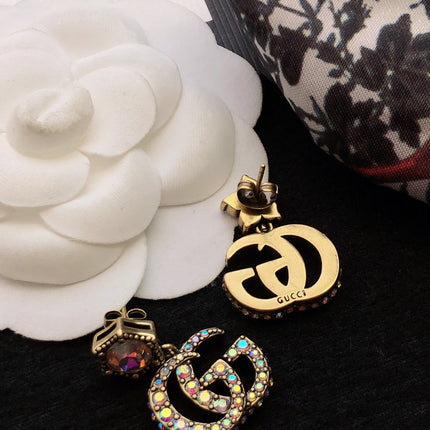 GUCCI 26S DOUBLE G LOGO MULTICOLOR CRYSTAL DROP STATEMENT EARRINGS IN AGED GOLD TONE METAL 629027