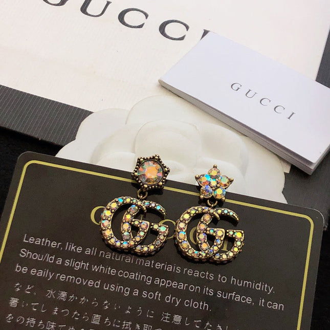 GUCCI 26S DOUBLE G LOGO MULTICOLOR CRYSTAL DROP STATEMENT EARRINGS IN AGED GOLD TONE METAL 629027
