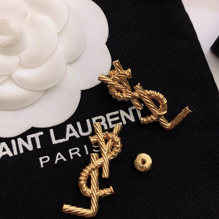 YSL 26S TWISTED ROPE LOGO STUD EARRINGS IN GOLD TONE METAL 629135