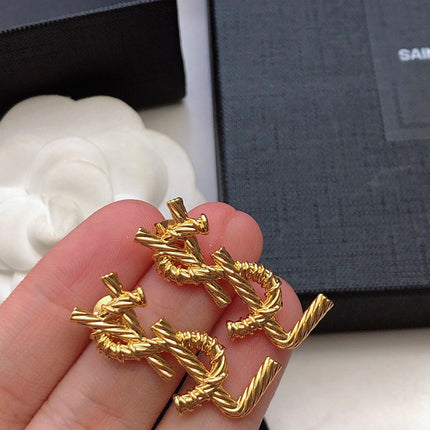 YSL 26S TWISTED ROPE LOGO STUD EARRINGS IN GOLD TONE METAL 629135