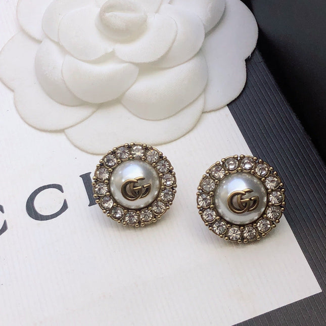 GUCCI 26S DOUBLE G LOGO PEARL CRYSTAL HALO STUD EARRINGS IN AGED GOLD TONE METAL 629031