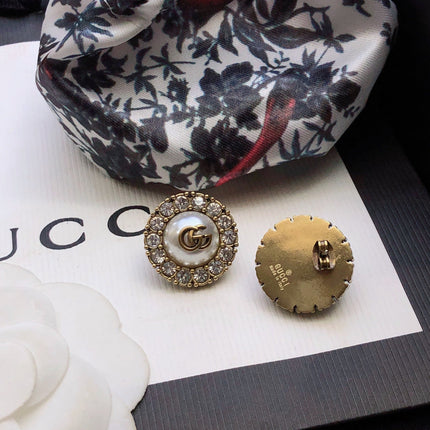 GUCCI 26S DOUBLE G LOGO PEARL CRYSTAL HALO STUD EARRINGS IN AGED GOLD TONE METAL 629031