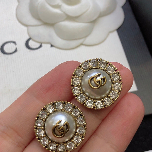 GUCCI 26S DOUBLE G LOGO PEARL CRYSTAL HALO STUD EARRINGS IN AGED GOLD TONE METAL 629031