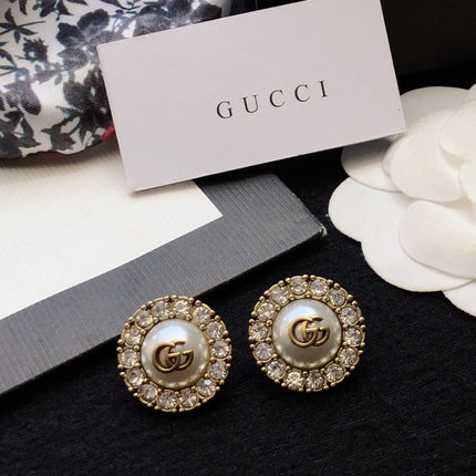 GUCCI 26S DOUBLE G LOGO PEARL CRYSTAL HALO STUD EARRINGS IN AGED GOLD TONE METAL 629031