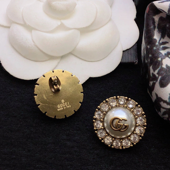 GUCCI 26S DOUBLE G LOGO PEARL CRYSTAL HALO STUD EARRINGS IN AGED GOLD TONE METAL 629031
