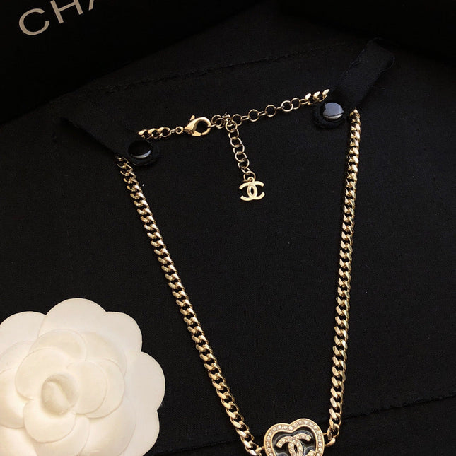 CHANEL 26S DOUBLE C LOGO PAVE CRYSTAL HEART CHAIN BRACELET IN GOLD METAL 633321