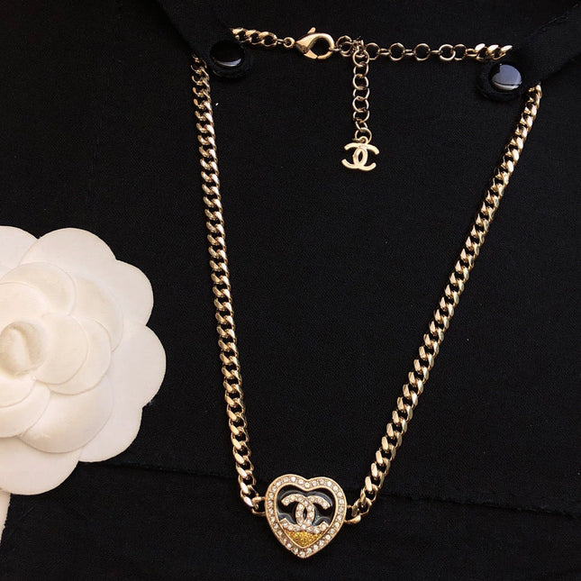 CHANEL 26S DOUBLE C LOGO PAVE CRYSTAL HEART CHAIN BRACELET IN GOLD METAL 633321