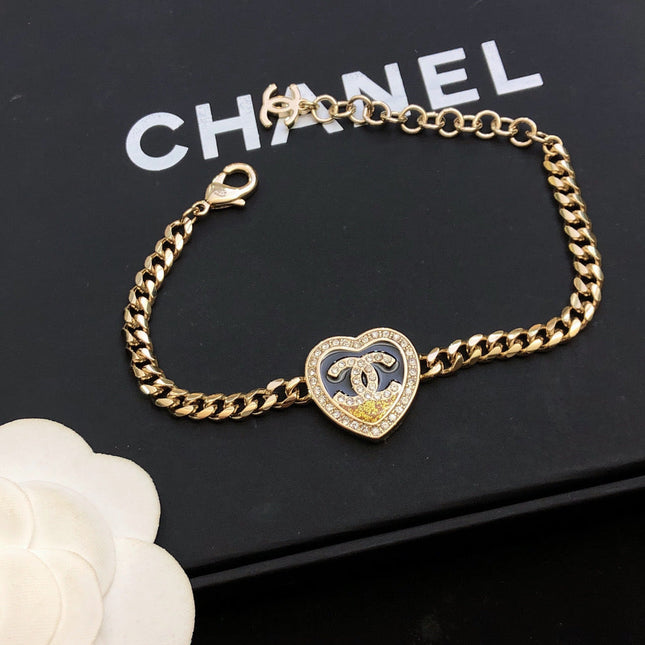 CHANEL 26S DOUBLE C LOGO PAVE CRYSTAL HEART CHAIN BRACELET IN GOLD METAL 633321