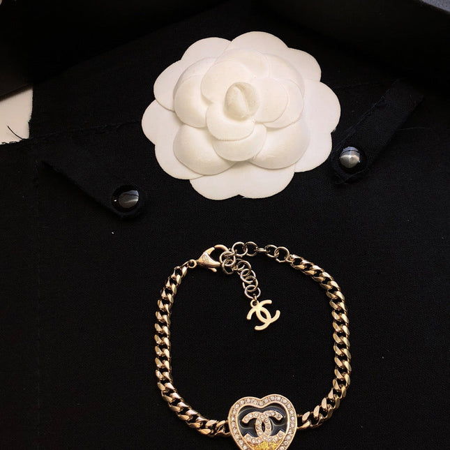 CHANEL 26S DOUBLE C LOGO PAVE CRYSTAL HEART CHAIN BRACELET IN GOLD METAL 633321