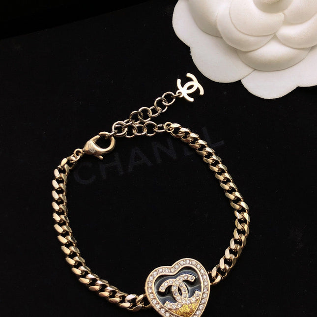 CHANEL 26S DOUBLE C LOGO PAVE CRYSTAL HEART CHAIN BRACELET IN GOLD METAL 633321
