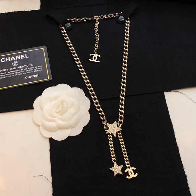 CHANEL 26S CHANEL CC LOGO DOUBLE CHAIN STAR DROP NECKLACE IN GOLD METAL 633324