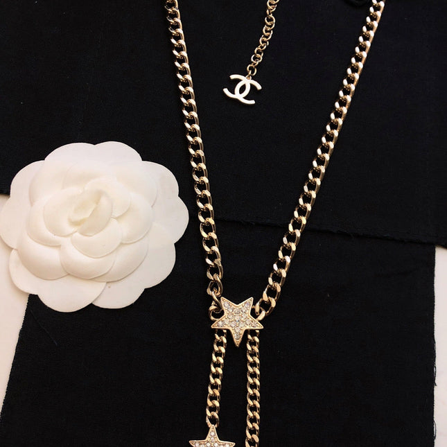 CHANEL 26S CHANEL CC LOGO DOUBLE CHAIN STAR DROP NECKLACE IN GOLD METAL 633324