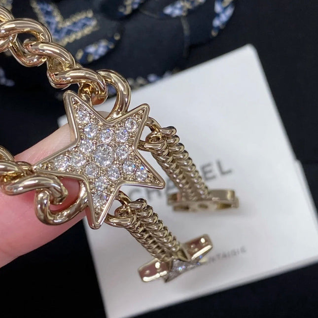 CHANEL 26S CHANEL CC LOGO DOUBLE CHAIN STAR DROP NECKLACE IN GOLD METAL 633324