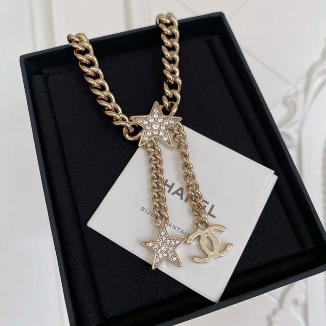 CHANEL 26S CHANEL CC LOGO DOUBLE CHAIN STAR DROP NECKLACE IN GOLD METAL 633324